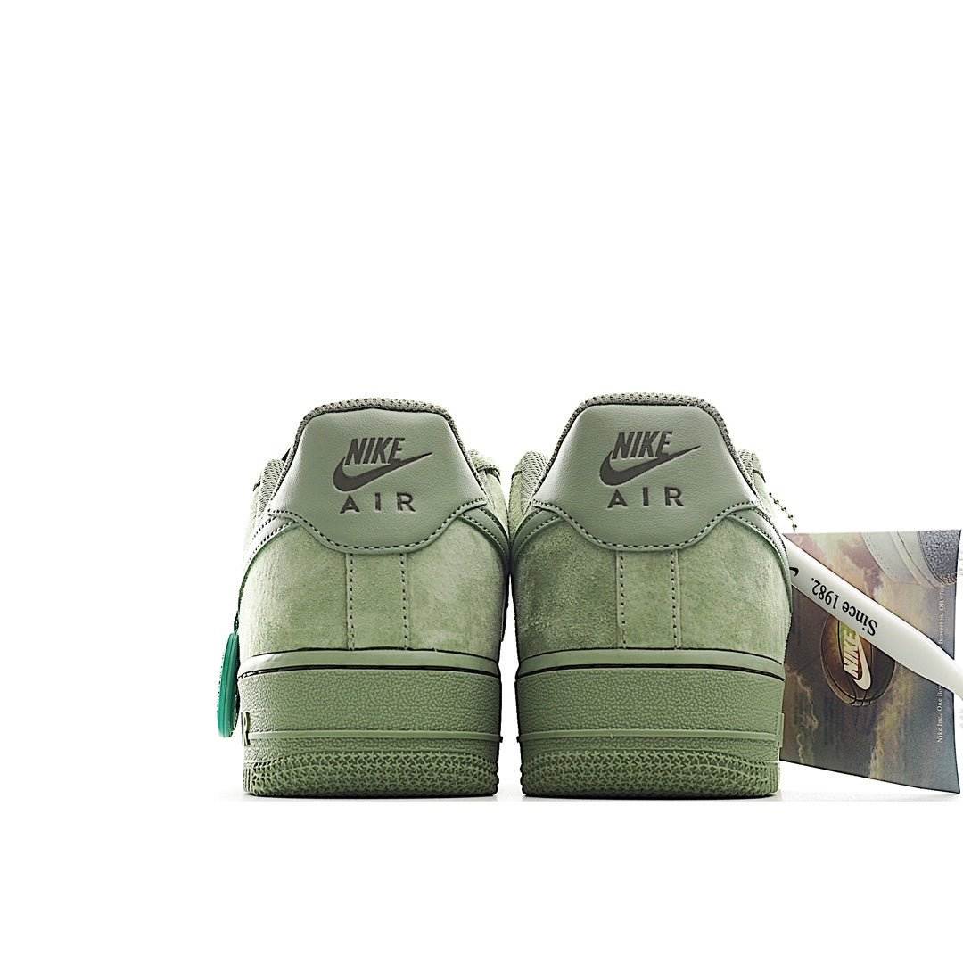 Nike Air Force 1 low-top sneakers, light green suede back view with NIKE AIR on heel