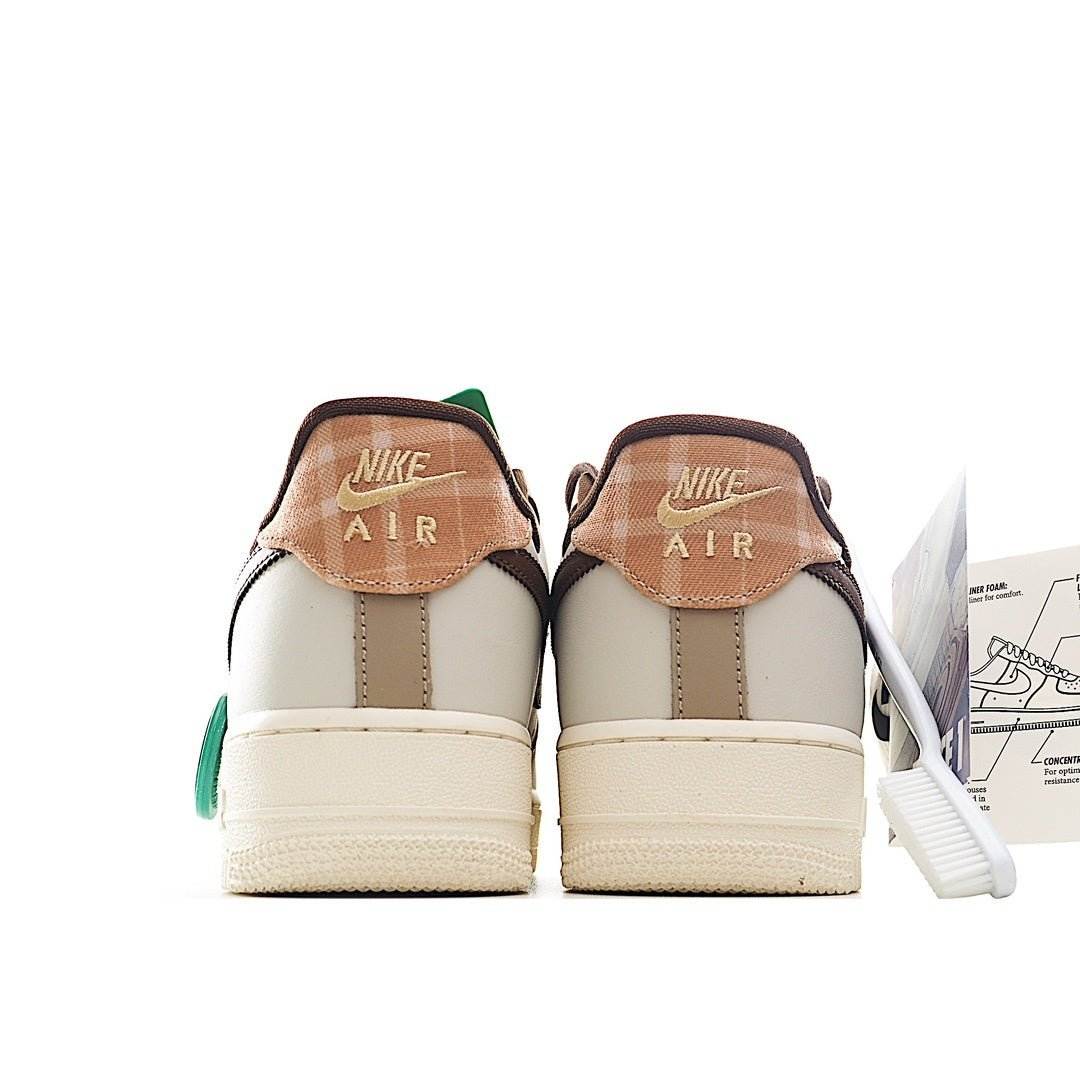Air Force 1 sneakers, cream back view with brown heel tab and green pull
