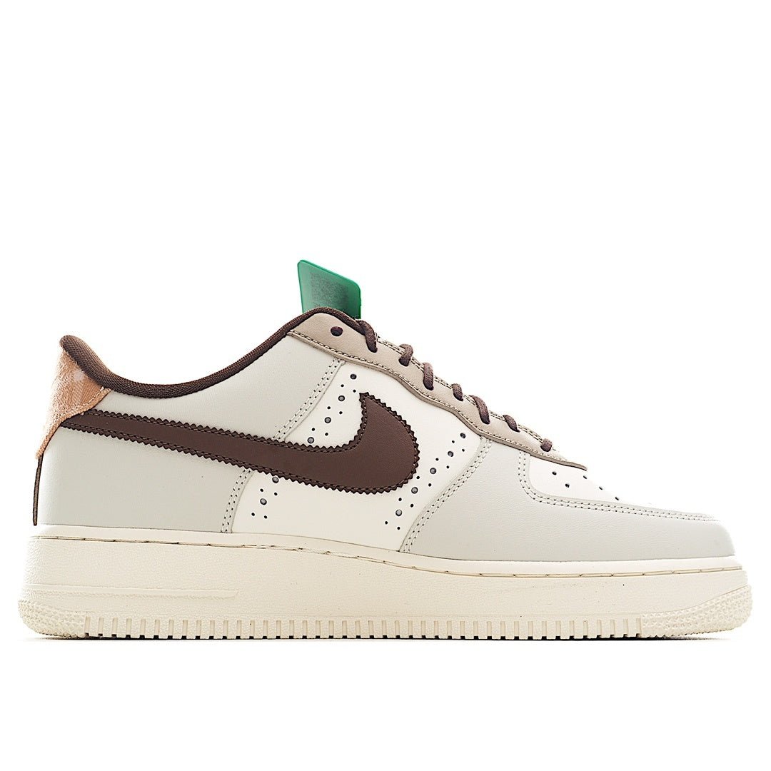 White Nike Air Force 1 low-top with brown swoosh and green hang tag