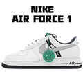 White Nike Air Force 1 sneakers with gray swoosh and green lace tag.