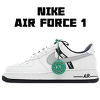 White Nike Air Force 1 sneakers with gray swoosh and green lace tag.
