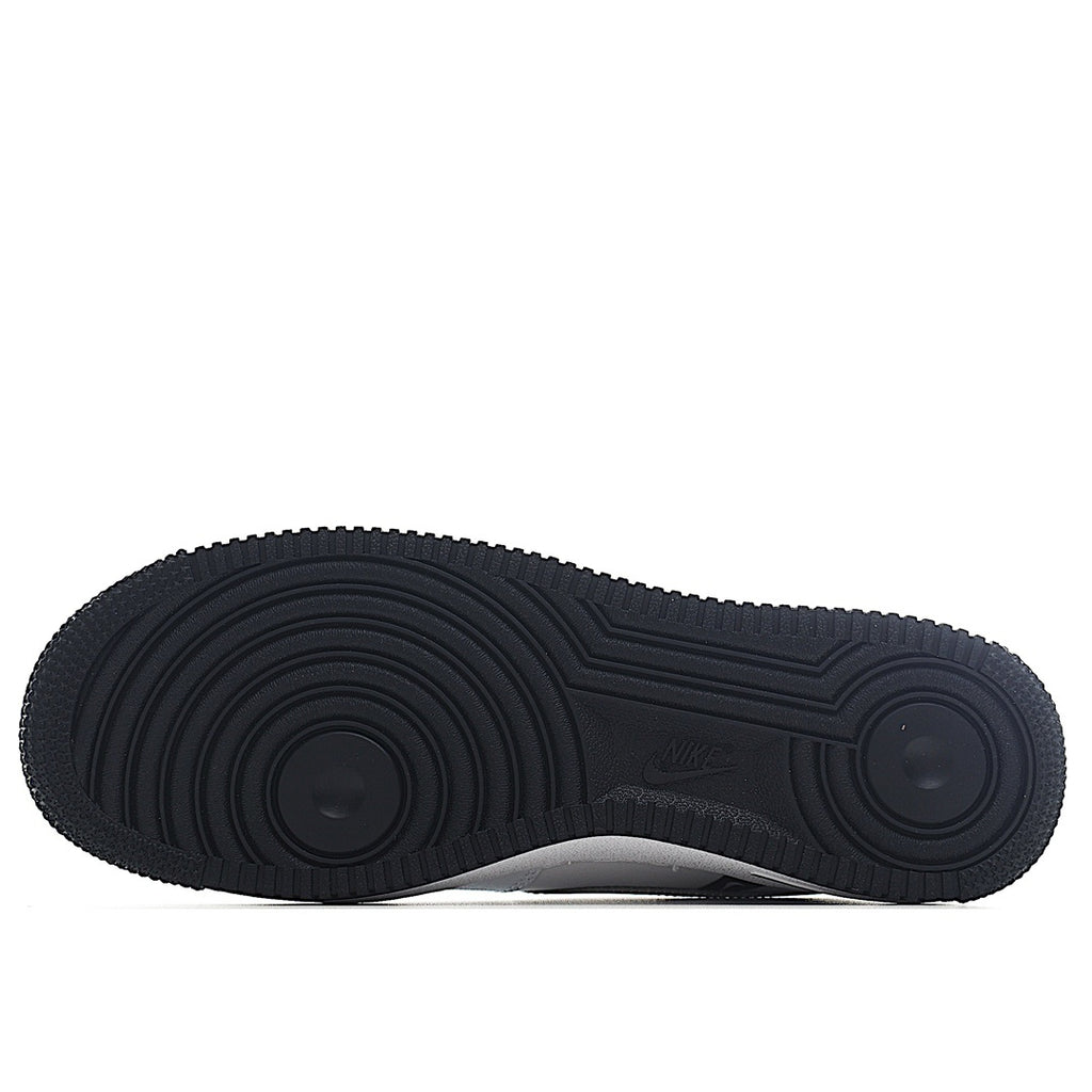 Black Nike Air Force 1 rubber outsole with deep tread pattern.