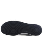 Black Nike Air Force 1 rubber outsole with deep tread pattern.
