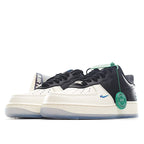 Nike Air Force 1 low sneakers, side view; black and white leather with blue swoosh, green accents