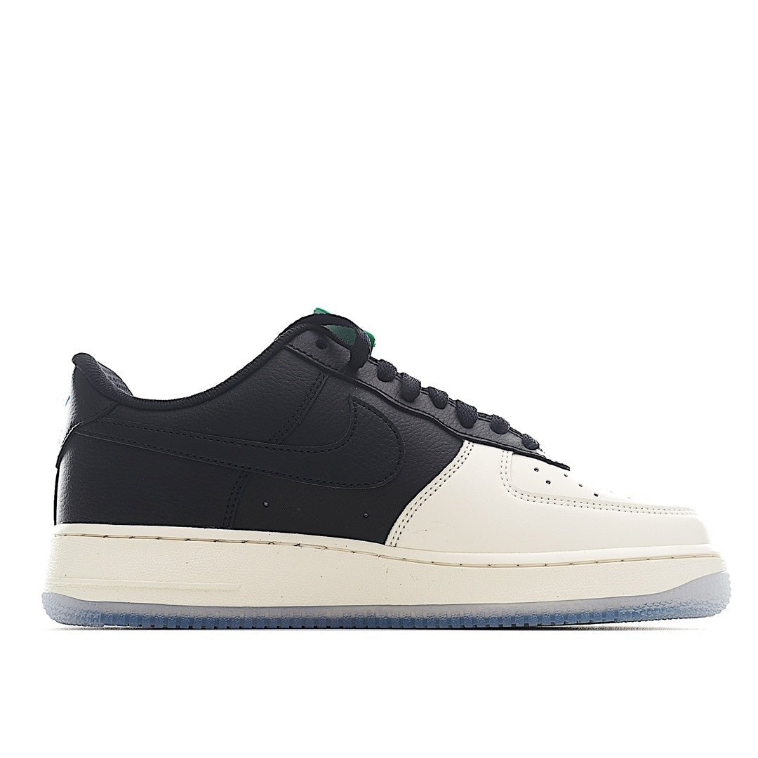 Nike Air Force 1 low sneakers, side profile; black upper with white toe, green lace loop