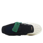 Nike Air Force 1 low sneakers, heel and outsole; black leather with white sole, green label