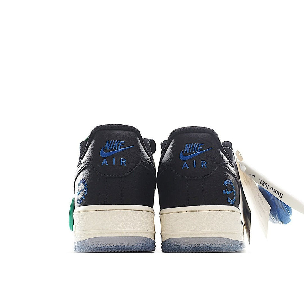 Nike Air Force 1 low sneakers, back view; black leather with white midsoles, green accents