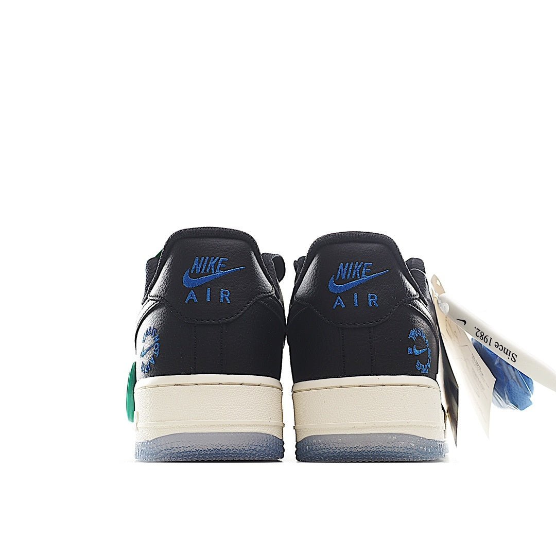 Nike Air Force 1 low sneakers, back view; black leather with white midsoles, green accents