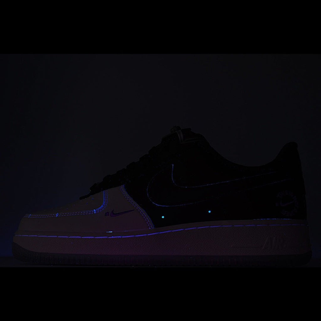 Nike Air Force 1 sneakers, dark silhouette with blue details and light sole