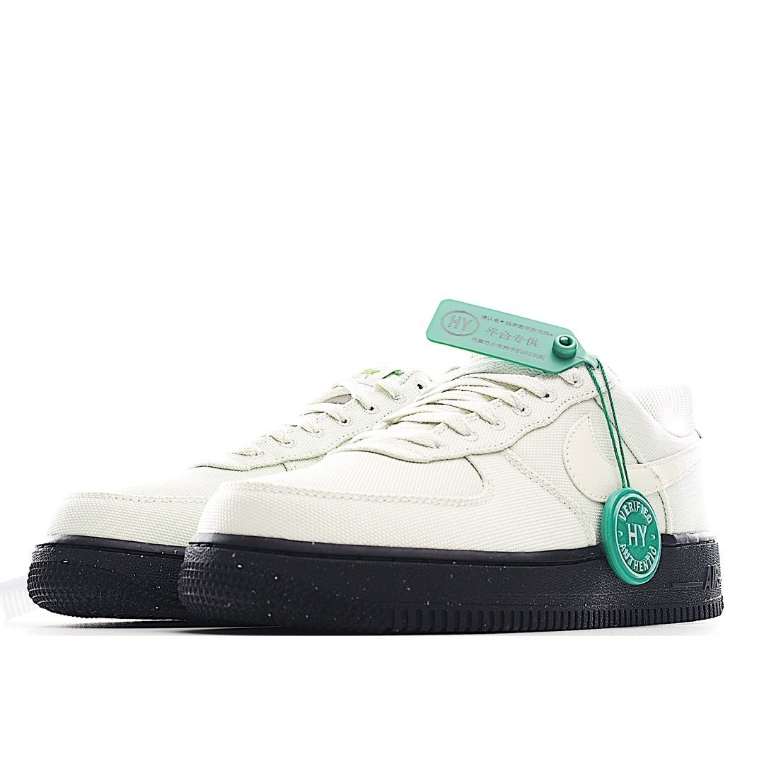 White sneaker side view with teal tag and black rubber sole