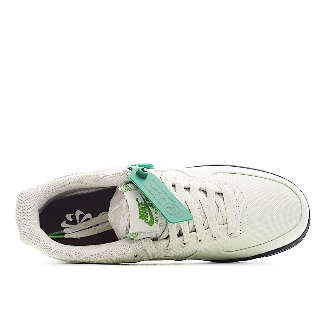 White sneaker with teal tag, showing inner lining and laces
