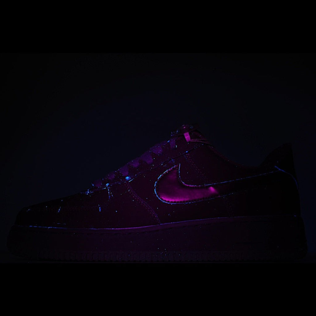 Air Force 1 sneakers in dark purple tones with subtle purple swoosh and sole.