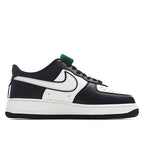 Black and white low-top sneakers with white Nike swoosh and green lace tag