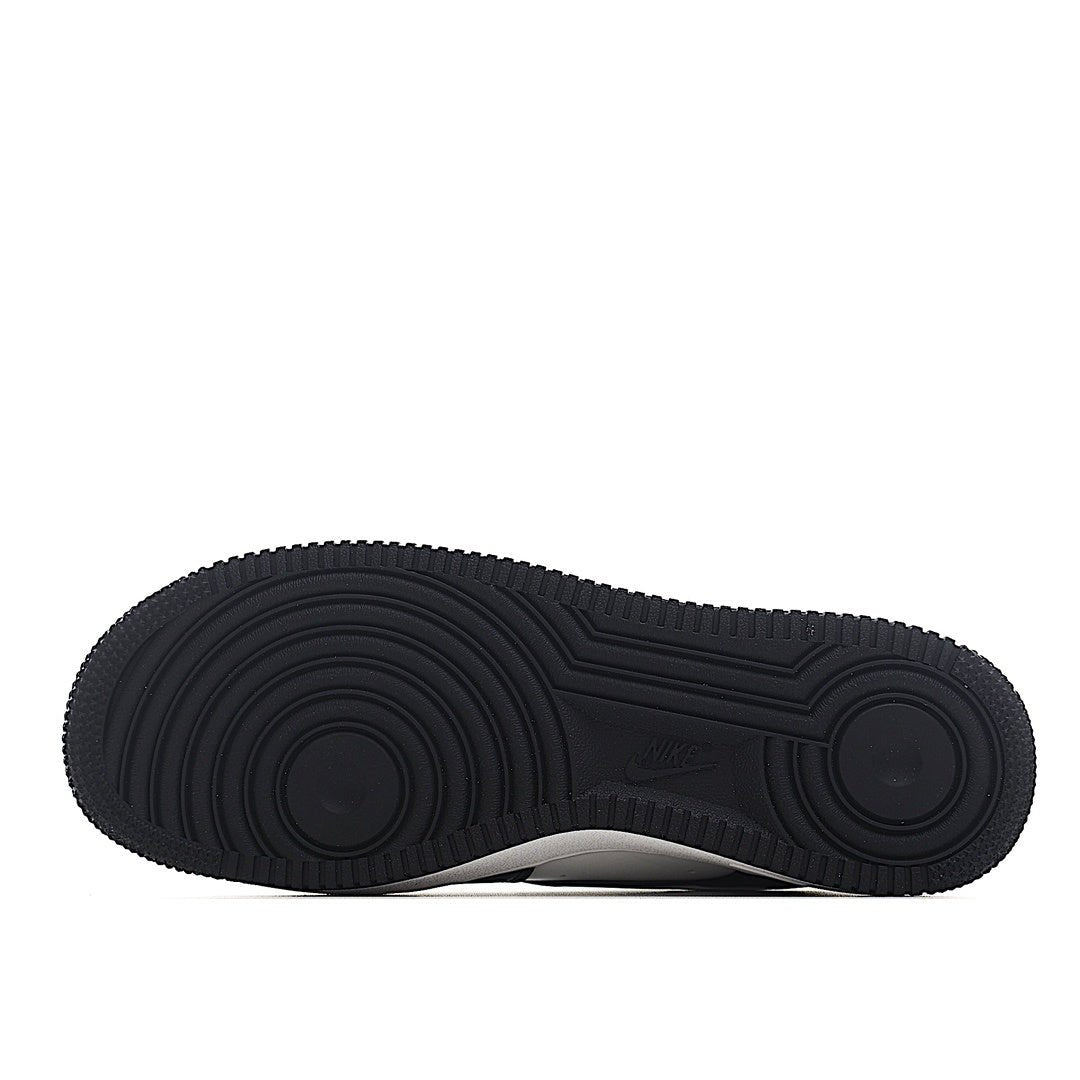 Black rubber outsole with circular tread pattern for Air Force 1 sneakers