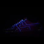 Dark blue Air Force 1 sneakers with glowing blue outline and white laces