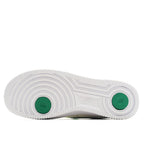 White rubber outsole with green circular traction pods