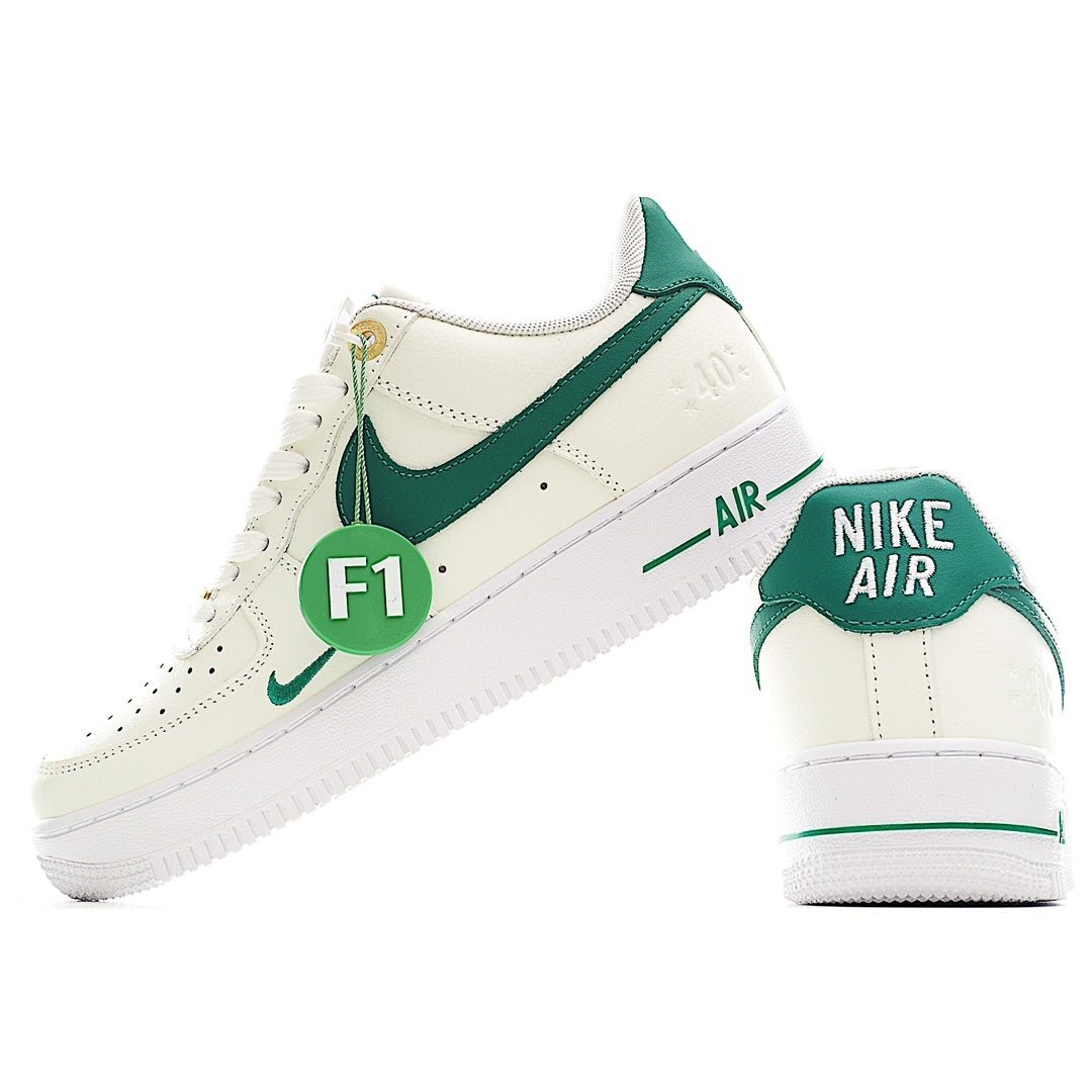 White and green low-top sneakers with diagonal swoosh and “AIR” branding