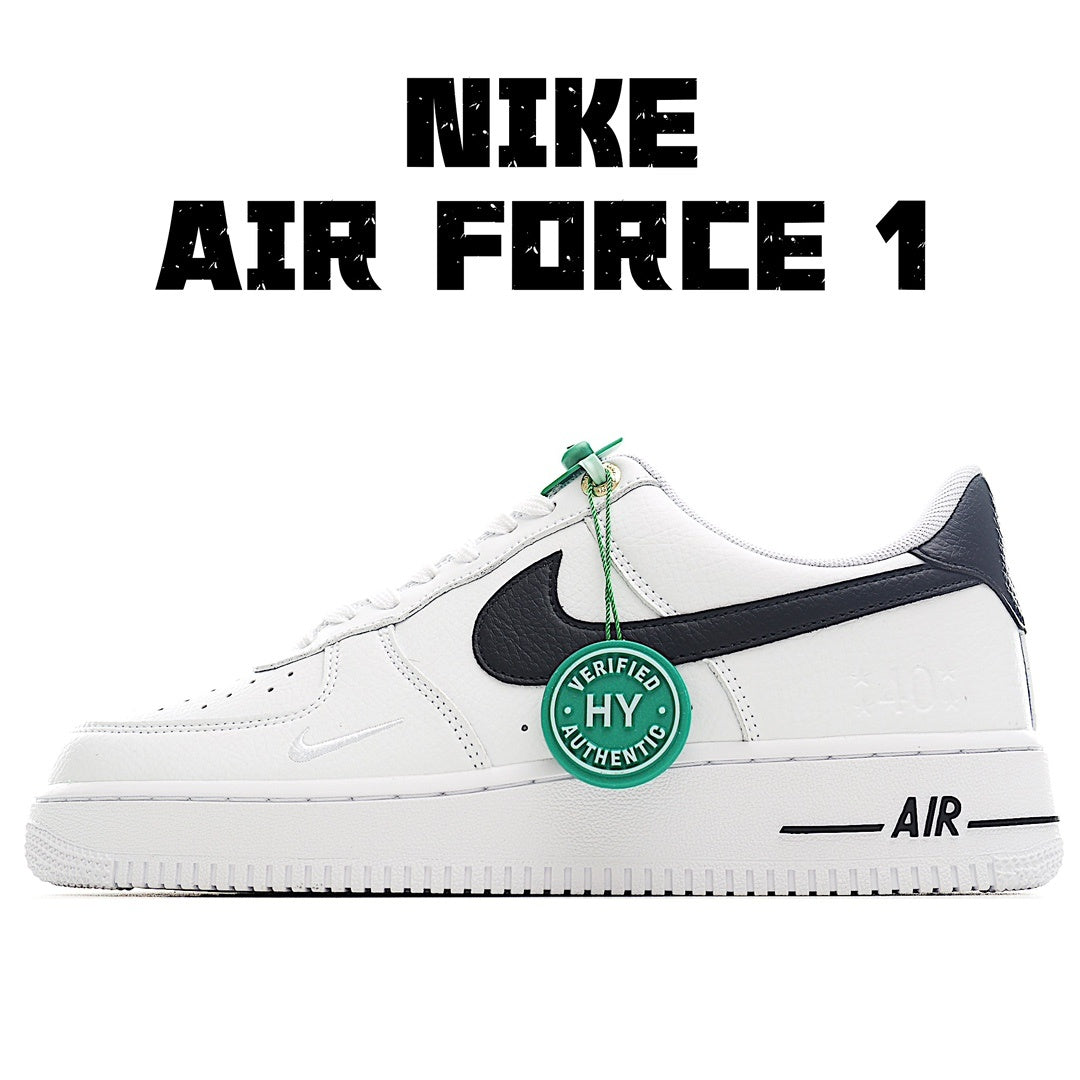 White leather sneaker with black swoosh, green lace tag, and Air sole branding