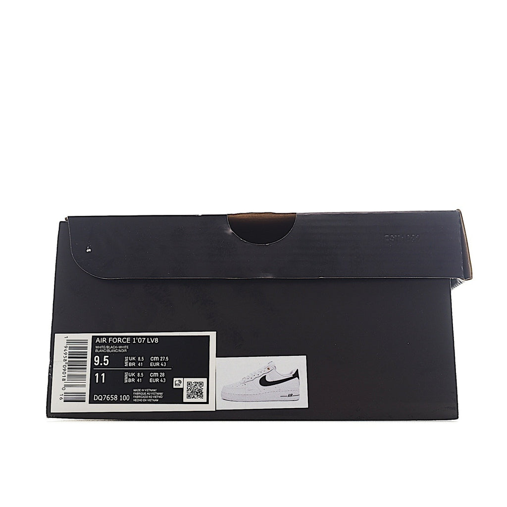 Black shoe box with size label sticker for a white sneaker