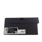 Black shoe box with size label sticker for a white sneaker