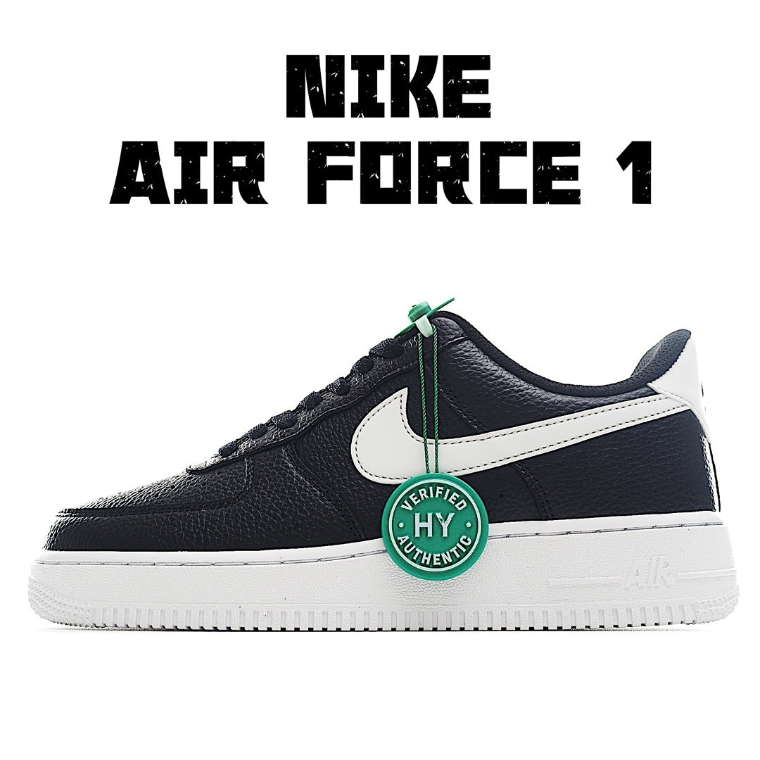 Low-top Nike Air Force 1 sneakers, black/navy with white swoosh and green HY tag