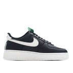 Nike Air Force 1 low-top in black/navy with white swoosh and green lace tag