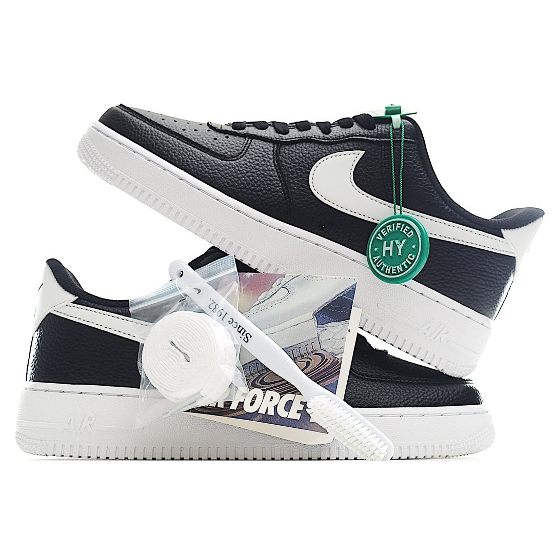 Nike Air Force 1 sneakers, black/navy with white swoosh, green HY tag on laces