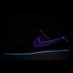 Dark Nike Air Force 1 sneakers with blue outline swoosh and white midsole