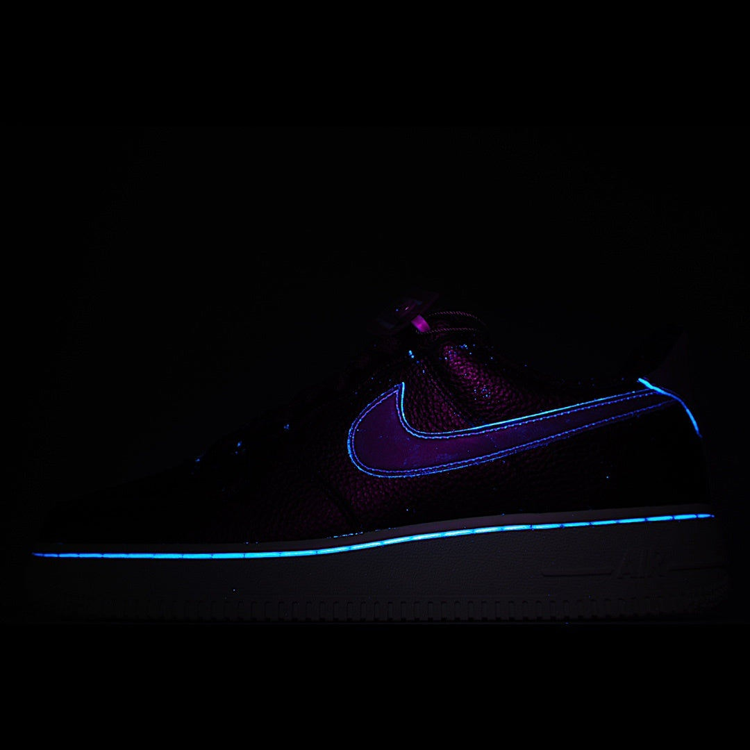 Dark Nike Air Force 1 sneakers with blue outline swoosh and white midsole