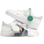 White Nike Air Force 1 sneakers with green Verified tag and gold side swoosh