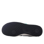 Rubber outsole for low-top sneaker, dark tread with circular traction pods.