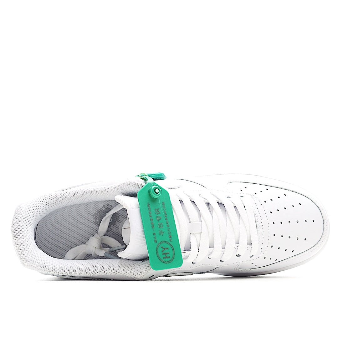 Nike Air Force 1 low-top sneaker, white upper with green lace eyelet and inner lining