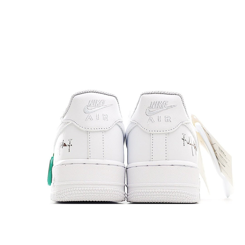 Nike Air Force 1 low-top sneaker, white back view with green lace pull and heel tabs