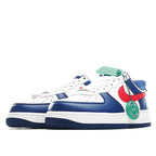 White low-top sneakers with blue panels, red swoosh, and green lace accents