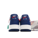 Pair of blue sneakers with white midsoles, red heel accents, and Nike Air branding