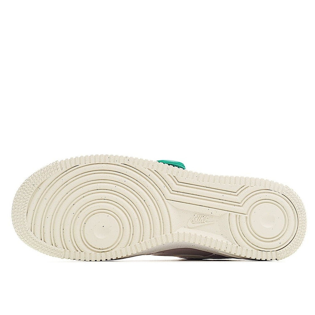White sneaker outsole with ridged tread and Nike logo