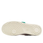 White sneaker outsole with ridged tread and Nike logo