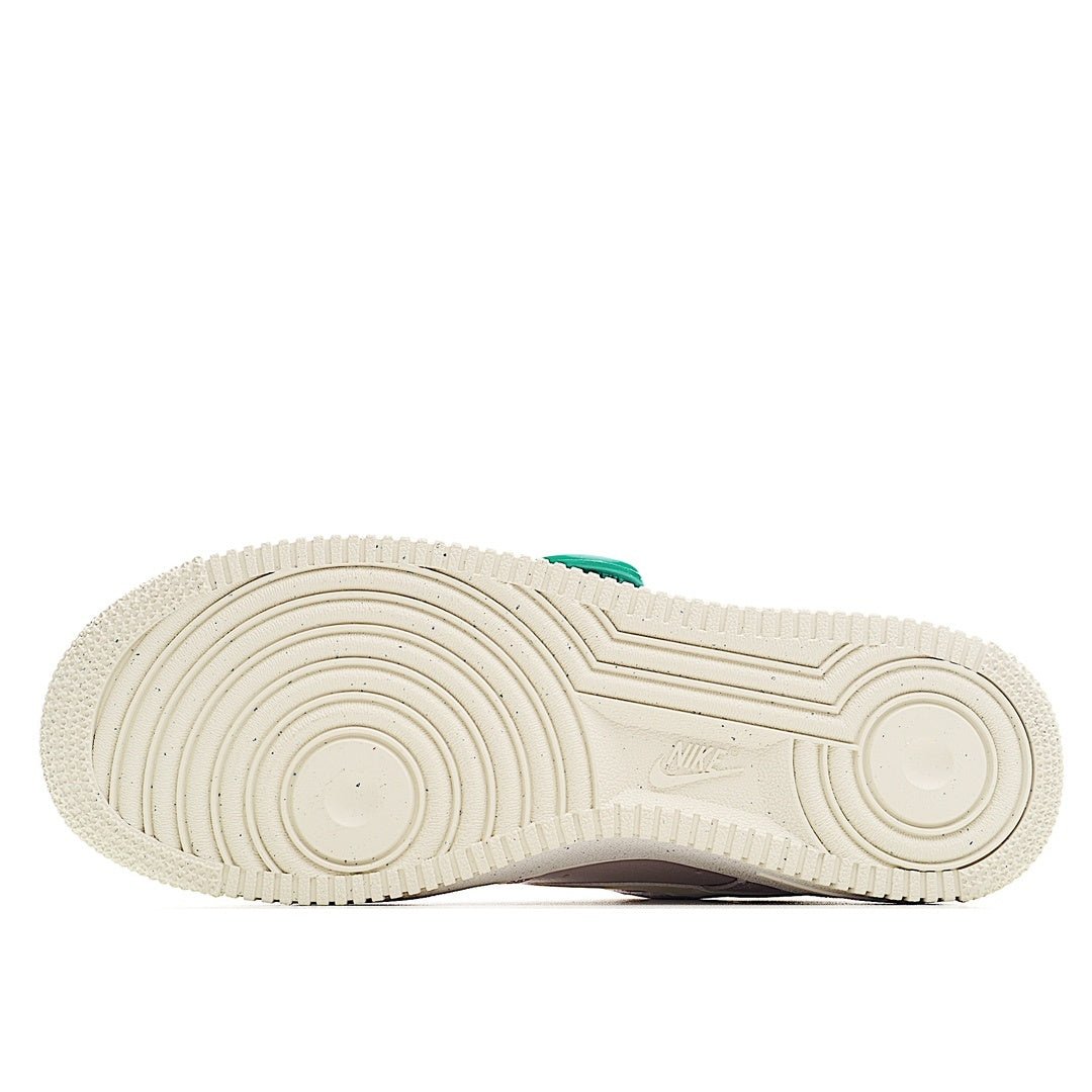 White sneaker outsole with ridged tread and Nike logo