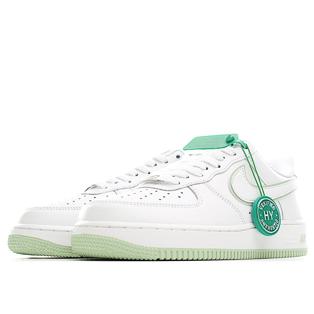 White low-top Air Force 1 sneaker with green heel tag and stitched side swoosh
