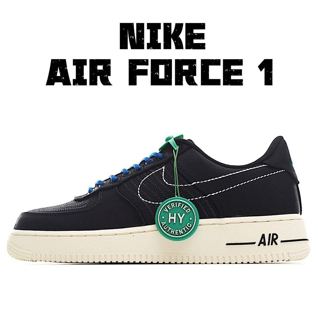 Black Nike Air Force 1 sneaker with blue laces and green tag, cream sole