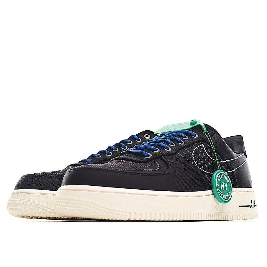 Black sneakers with blue lace-up front, cream sole, green “HY” heel tag