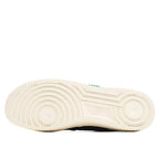 Cream rubber outsole with circular traction grooves, black heel