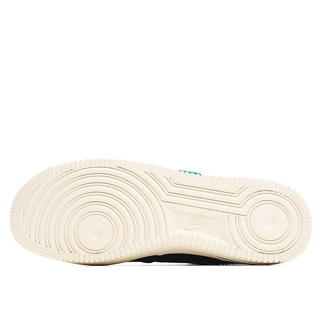 Cream rubber outsole with circular traction grooves, black heel