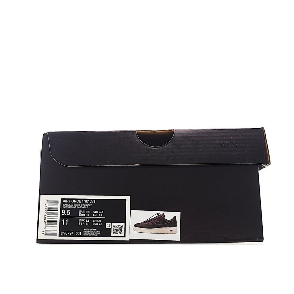 Black shoebox with white size label and barcode sticker