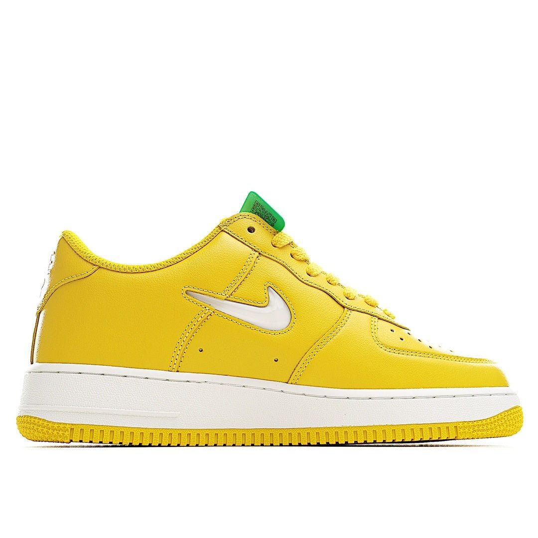 Yellow Nike Air Force 1 low-top sneaker, white swoosh, white midsole, green hang tag