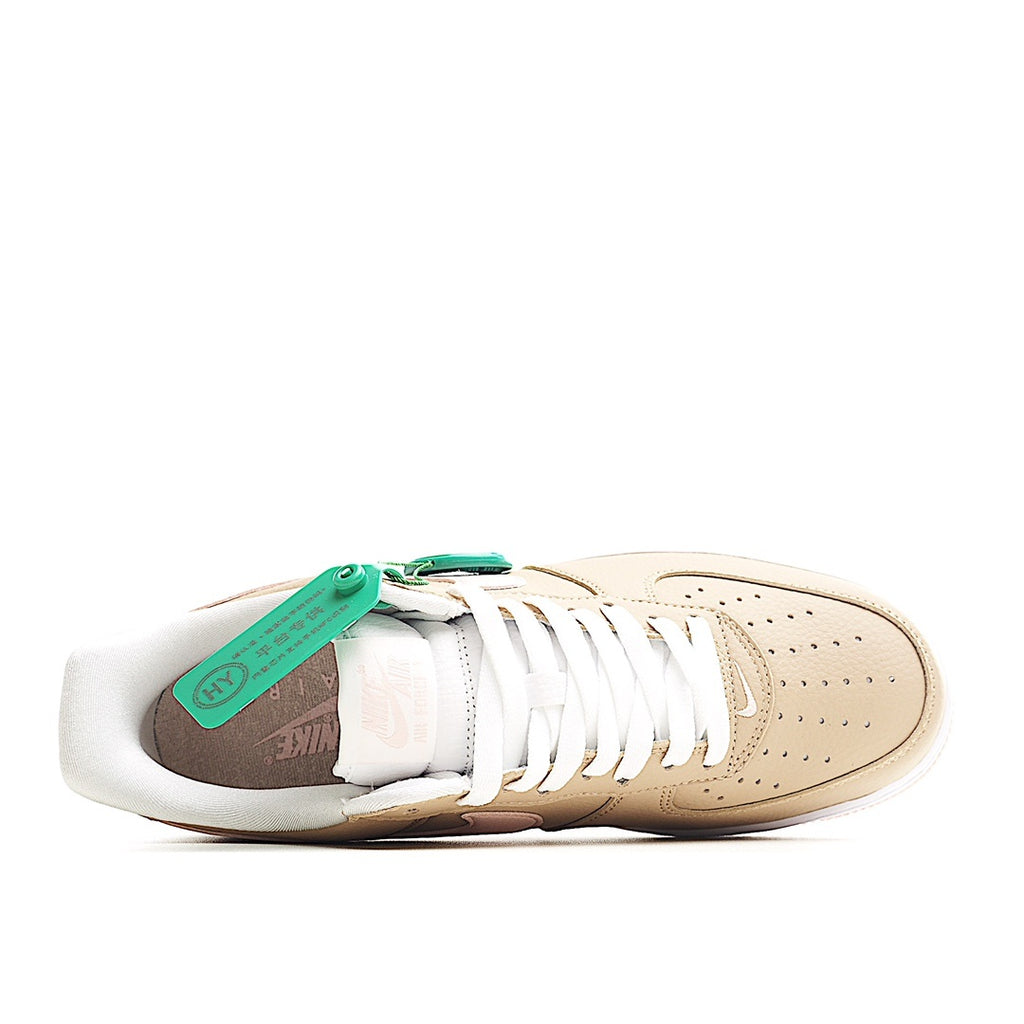 Beige sneaker with white laces and mint tag over the tongue