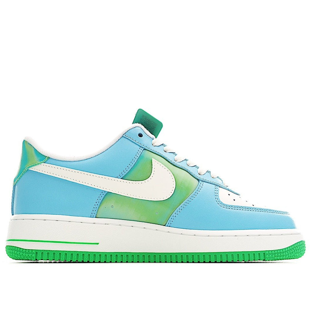 Low-top sneakers in light blue with green accent swoosh and white laces