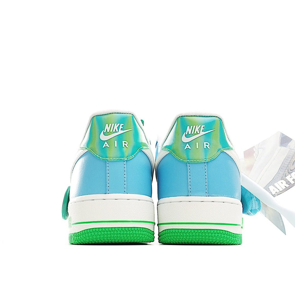 Back view of light blue low-top sneakers with green heel details