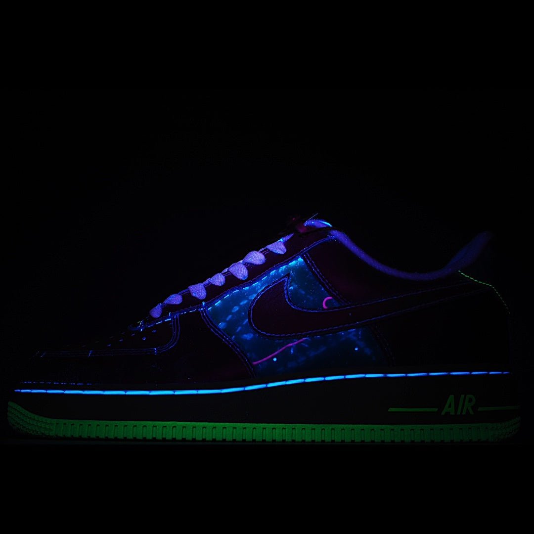 Low-top sneakers with neon blue and green glowing accents
