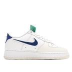 Nike Air Force 1 low-top sneakers, white leather with blue swoosh and blue heel panel